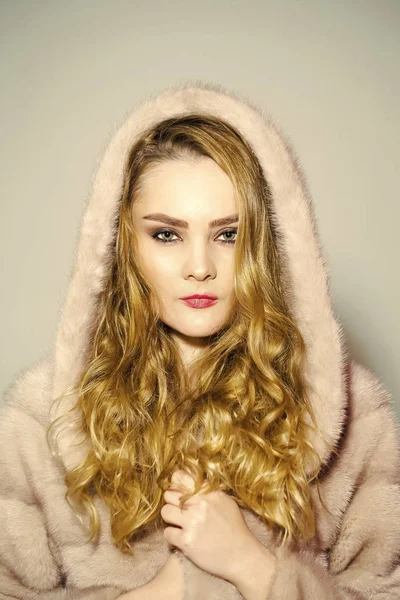 Beauty fashion model portrait. Woman in mink fur coat and hood on head — Stock Photo, Image