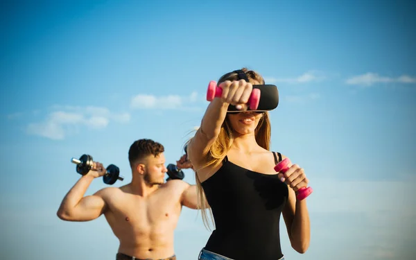 Virtual vision glasses. Woman use virtual simulator for fitness training. Virtual headset and gym equipment. In my virtual world