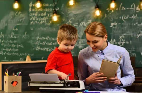 Teacher collaborates with colleagues, University students studying with books in library, Final exam test in university, Home tutor helping boy with studies using modern laptop