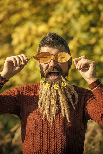 Hipster or bearded guy in autumn nature outdoor