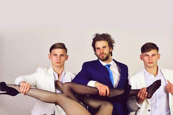 Group of people, men in jacket and female sexy legs — Stock Photo, Image
