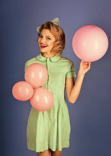 Retro woman with party balloons, celebration.