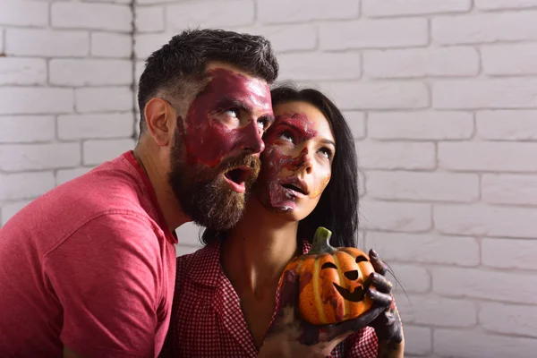 Halloween couple of man and woman with paint on face — Stock Photo, Image
