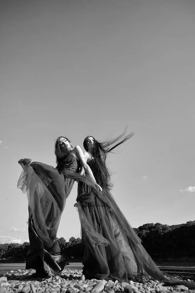 Women in violet dresses