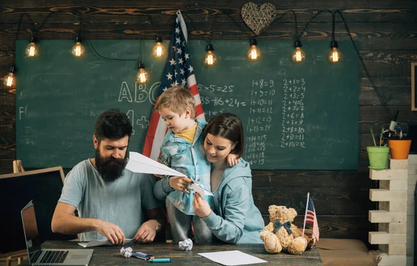 Fun concept. Family have fun in class. Little child and parents enjoy folding paper planes. Learning through fun. Say yes to some fun — Stock Photo, Image
