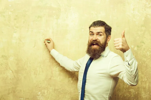 Business man with beard on happy face write with chalk — стоковое фото