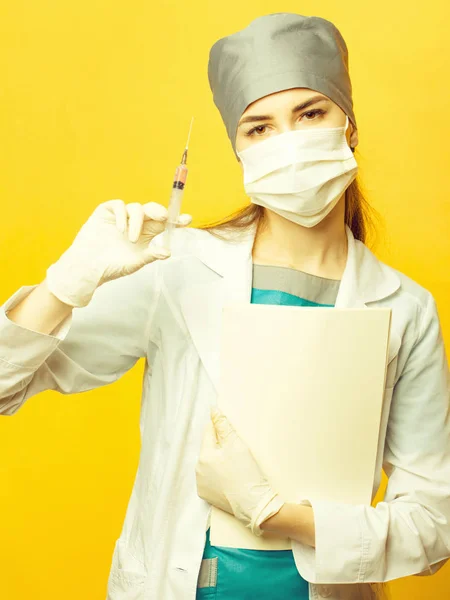 Nurse with syringe and folder — Stock Photo, Image