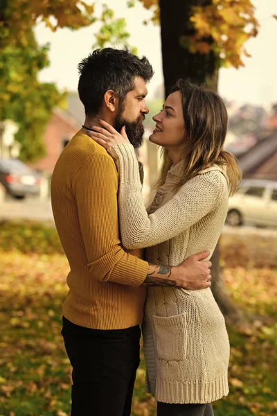 Couple in love in autumn park.