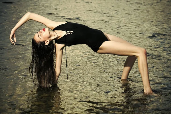 Woman swim at beach, nature, wet girl with long hair.