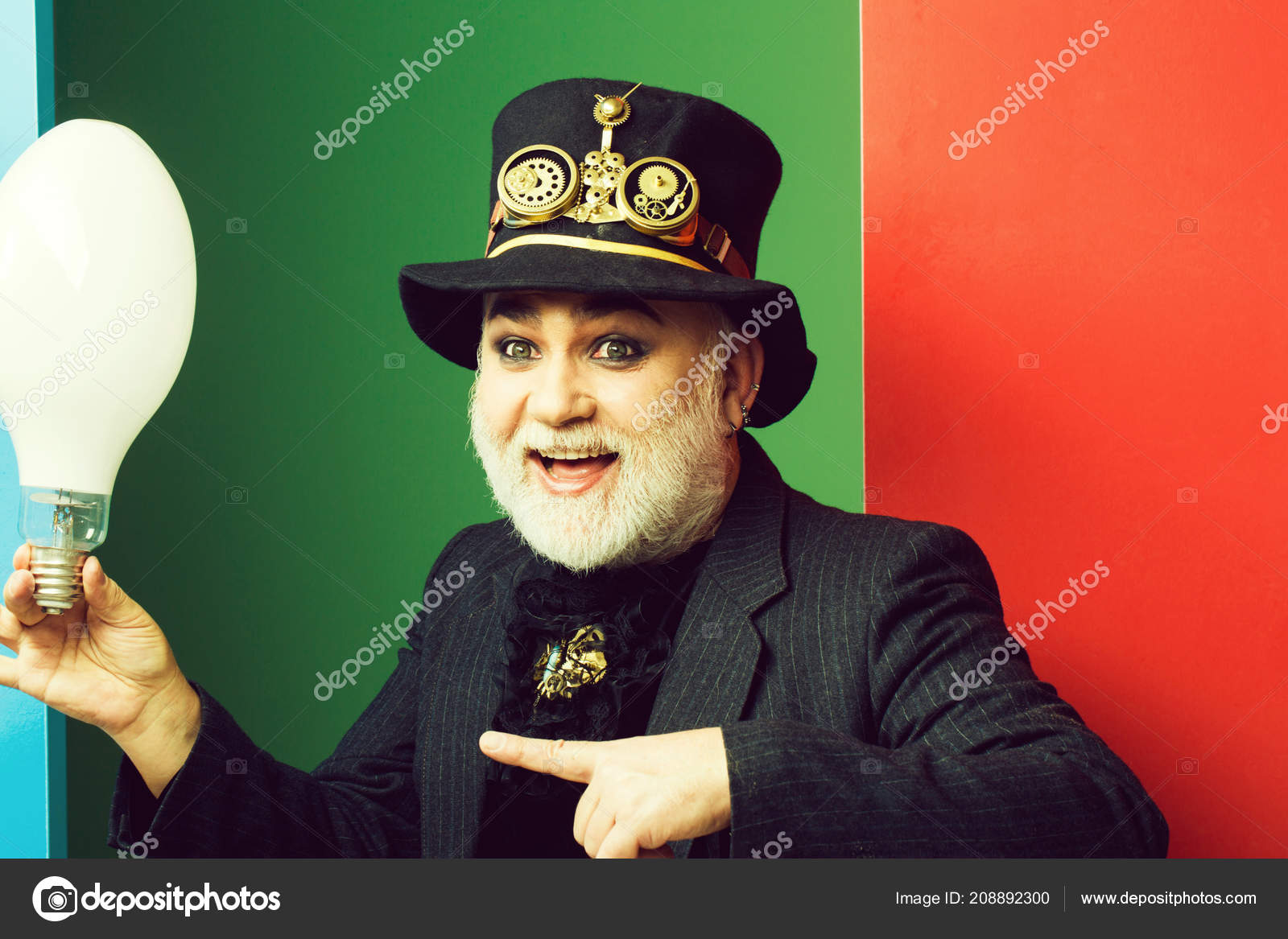 Smiling Man Holds Light Bulb Stock Photo C Tverdohlib Com 208892300
