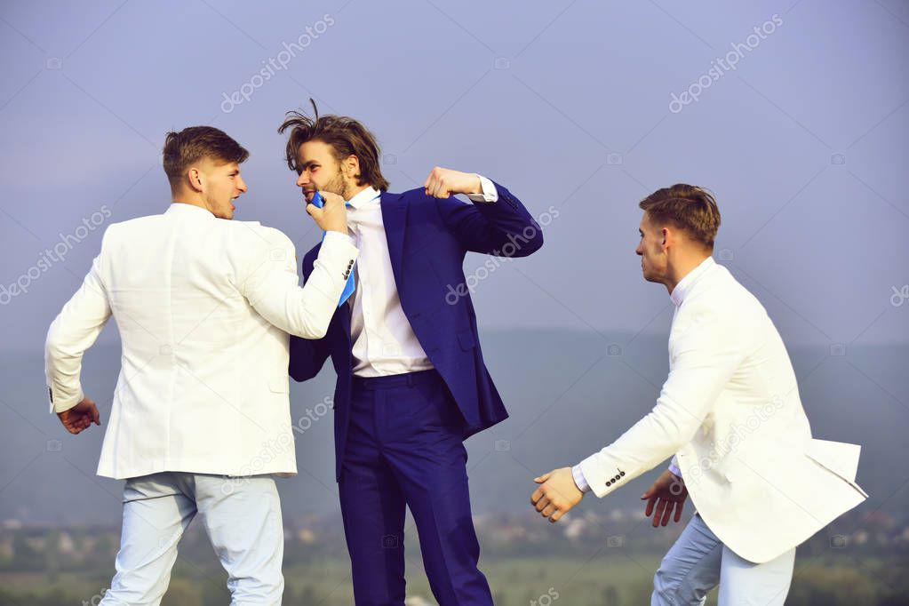 businessman punching, hitting colleague, twin men in formal outfit