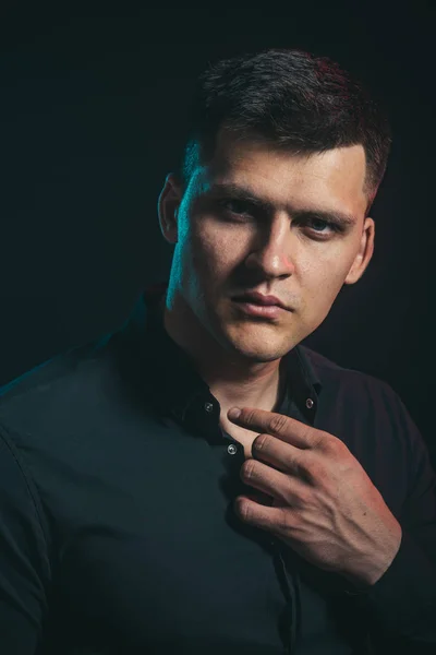 Stylish man with hair style on dark background. Style concept, man with serious face in stylish shirt — Stock Photo, Image