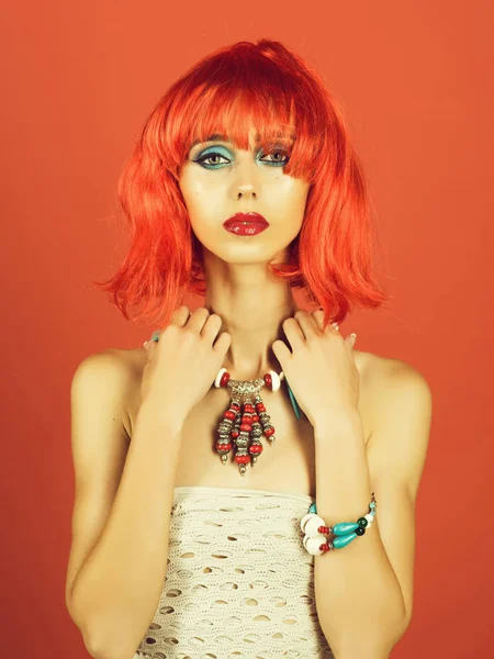 Girl with bright artificial hair in ethnic jewelry. — Stock Photo, Image