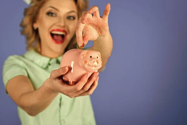 Retro woman hold moneybox, piggy bank for savings