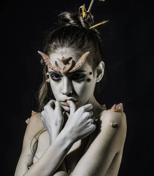 Halloween ideas concept. Woman with horns and thorns fantasy creature. Mystic fairy tail character. Diabolic appearance. Girl with thorns as devil dragon magical creature. Girl fantasy style makeup — Stock Photo, Image