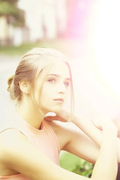 Blonde girl in pink shirt — Stock Photo, Image