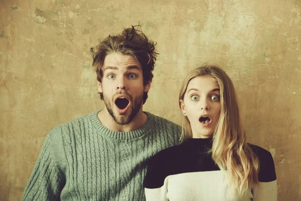 Wow Surprised man and woman with open mouth, young couple