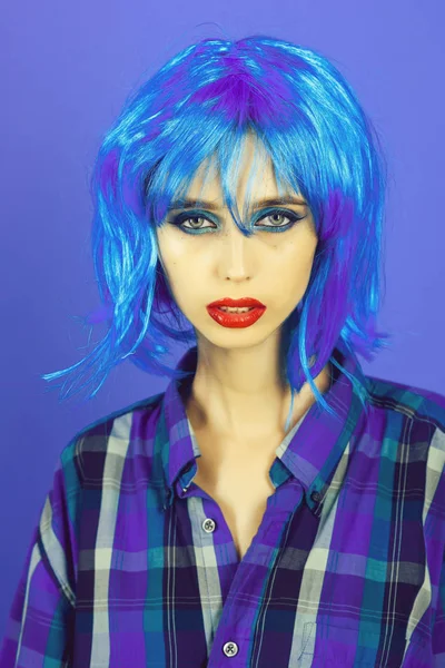 Fashion model in checkered shirt and red lips.