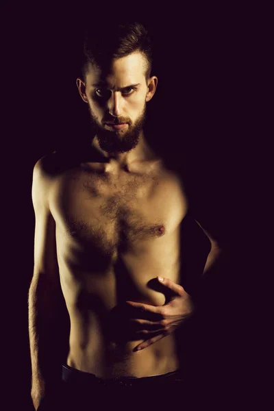 Slim bearded man with thin bare torso isolated on black — Stock Photo, Image