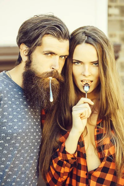 Young couple with tea spoon — Stock Photo, Image