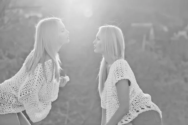 Lesbian couple of twin pretty girls flirting on sunny day — Stock Photo, Image