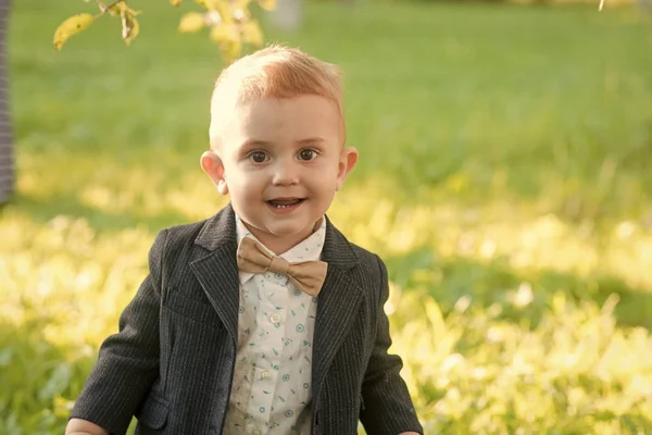 Child smile with bow tie on summer day, vacation — Stock Photo, Image