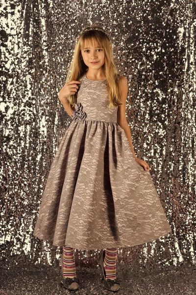 Fashion model on silver background, beauty. fashion model of small girl