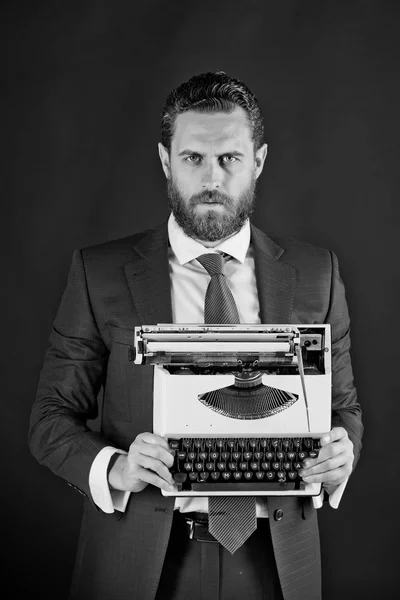 man with typewriter in fashion business suit
