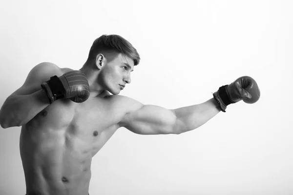 Fighter, man boxer, posing in red gloves in boxing stance — Stock Photo, Image