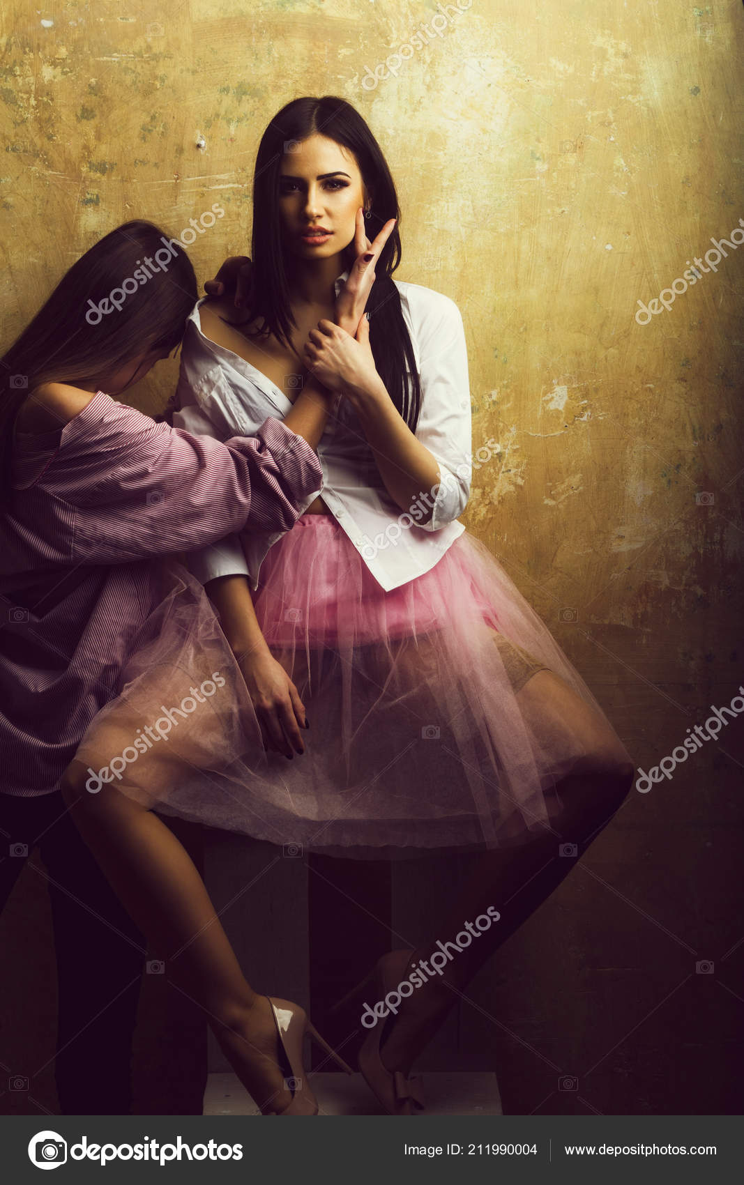 Pretty Sexy Women In Pink Skirt And Shirt On Chair Stock Photo