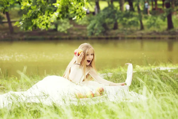 Small girl in dress with fruit basket — Stock Photo, Image