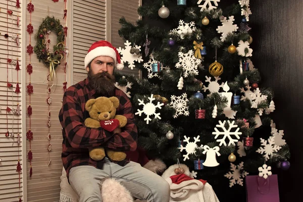 Christmas man with beard on face hold bear. — Stock Photo, Image