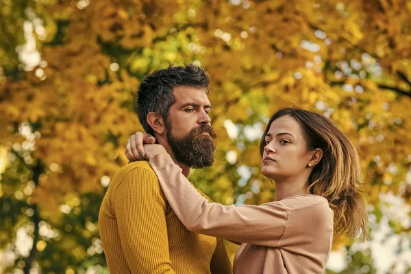 Couple in love in autumn park.