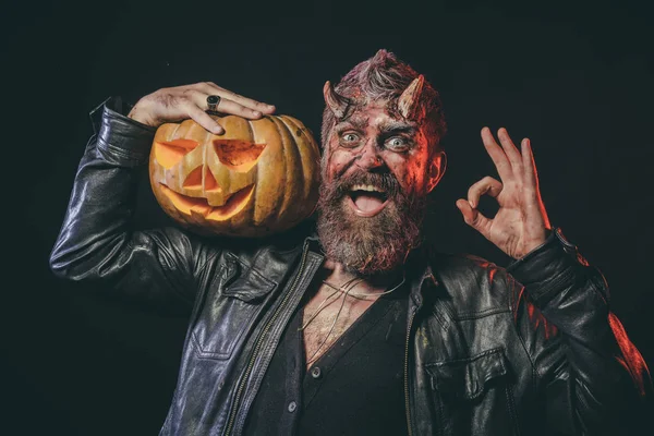 Halloween satan with smile, beard, wounds, red blood on face