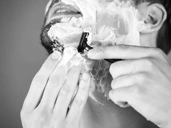 razor shaving beard hair of man