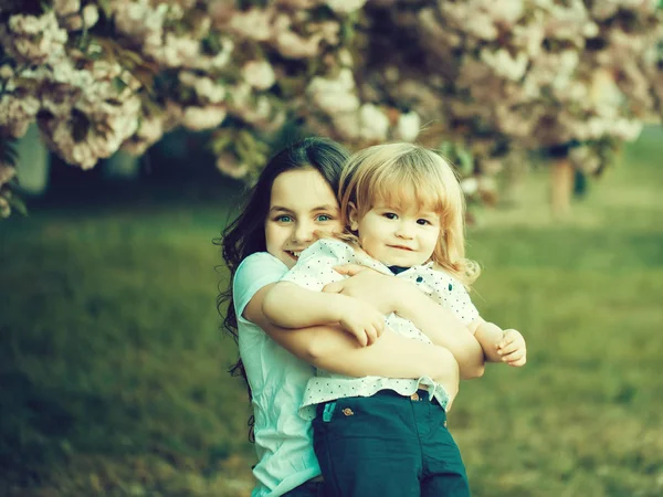 Happy children in orchard — Stock Photo, Image