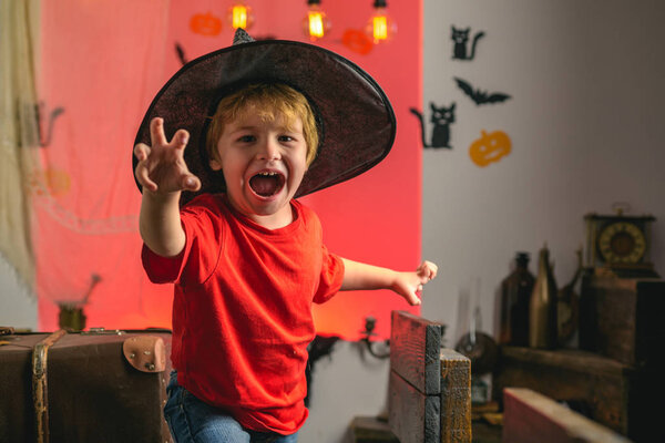Horror face. Secrets of Magic for Happy Halloween. Halloween kids party and funny Pumpkin. Funny boy.