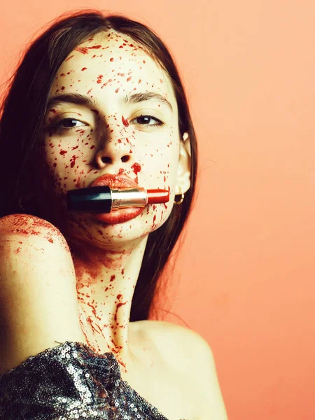 Scary woman with blood on face holding a rusty and bloody cleaver and meat  in front of her face. Sexy girl dress killer to Halloween festival. Fear  and horror. Steak concept. Stock
