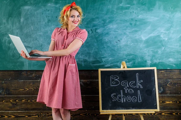Modern life in school. Online education as part of modern life. Happy teacher use new technology at lesson. Woman smile with laptop computer at blackboard — Stock Photo, Image