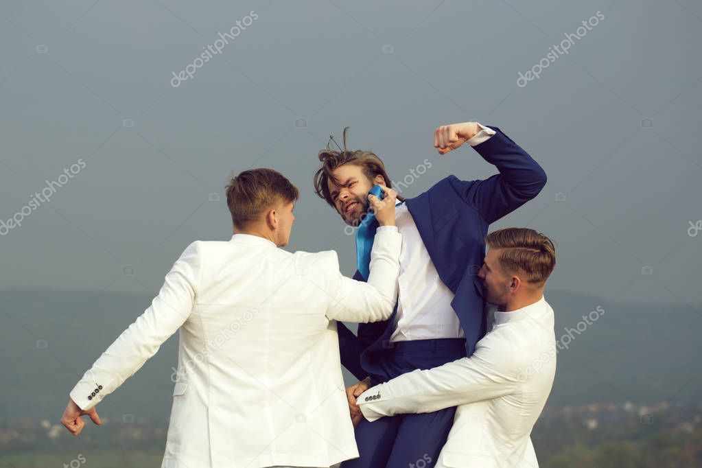 people fighting in nature on blue sky background