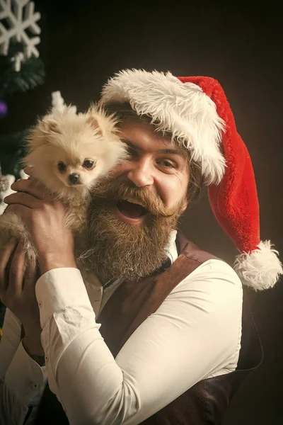 Christmas man with beard on happy face and pet.