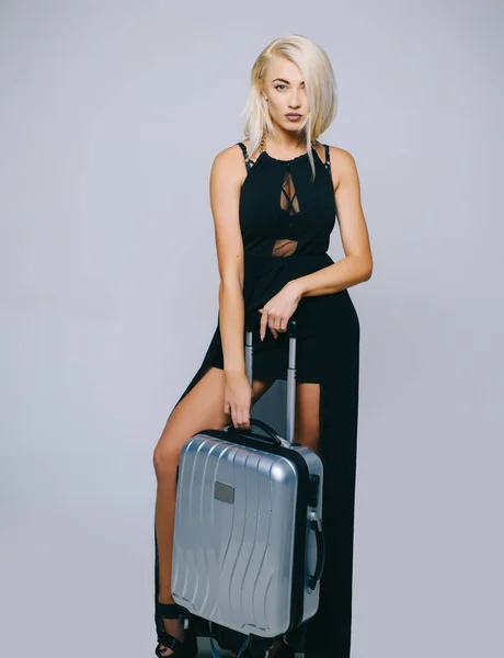 Woman with a suitcase at the airport. Ssuitcase travel concept. Travel woman. Luggage packing. Shopping and tourism. Isolated object - white background. Online shopping