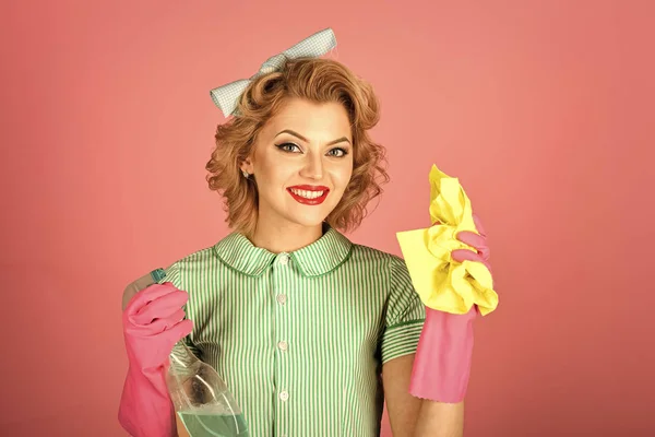 Retro woman cleaner on pink background.