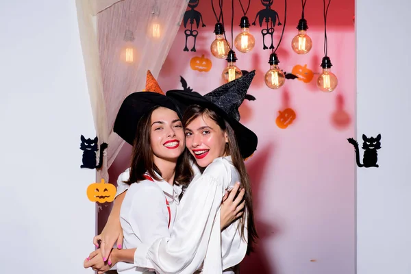 Happy Halloween. Happy thanksgiving day. Halloween emotional girlfriends hugging and enjoy positive moments. Beauty day concept. Friendship and friends.