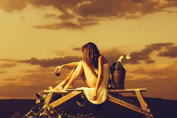 Pretty woman with wine over sky — Stock Photo, Image