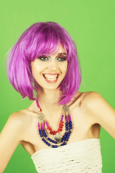 Girl smiling with bright artificial hair in ethnic jewelry. — Stock Photo, Image