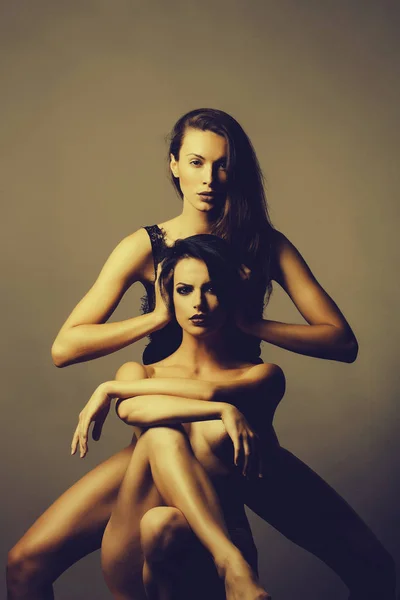 two pretty women with naked body