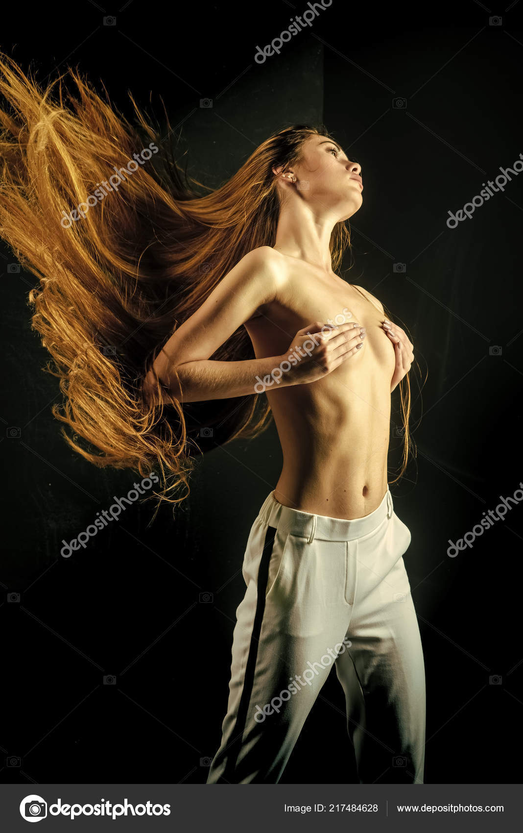Woman With Long Healthy Hair And Naked Chest Stock Photo