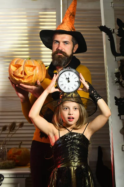 Little girl going to celebrate halloween soon. Little girl with alarm clock wait to Halloween coming soon. Keep calm, trick or treat and carry on. We will scare you soon — Stock Photo, Image