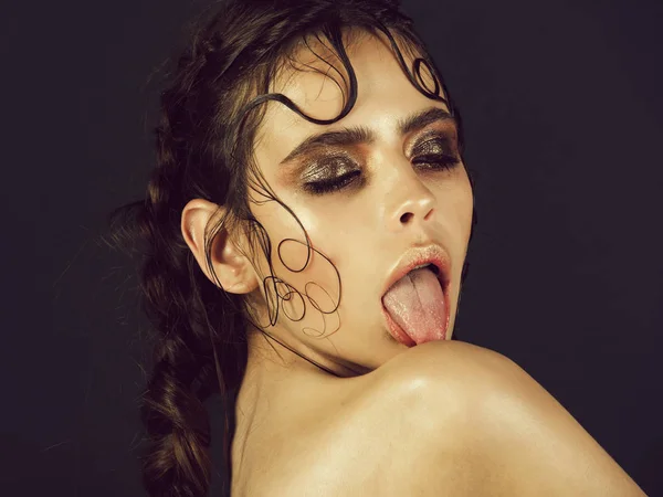 Cute woman licking naked shoulder with tongue — Stock Photo, Image
